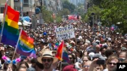 Israelis and tourists march during the Gay Pride Parade in Tel Aviv Israel, June 9, 2017. About 200,000 people from the LGBT community in Israel and abroad attended in Tel Aviv's annual gay pride parade. 