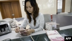 Kina ankohet ndaj presioneve të ligjvënësve amerikanë për juanin