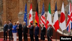 G- 7 စက်မှု ထိပ်သီးခေါင်းဆောင်များ။ ဓာတ်ပုံ - ရိုက်တာ။ 