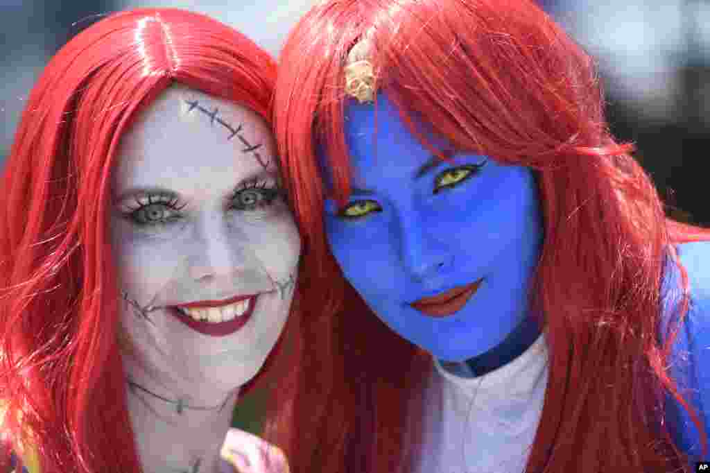Cherish Johnson, dressed as Sally from "The Nightmare Before Christmas," and Megan Severns, dressed as Mystique from the "X-Men" franchise, pose together on day one of Comic-Con International in San Diego.