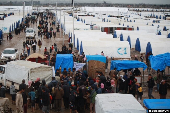 In the final weeks IS held a camp near Baghuz, Syria thousands of people evacuated the area, far more than any militaries or aid groups expected, pictured near Baghuz on March 10, 2019.