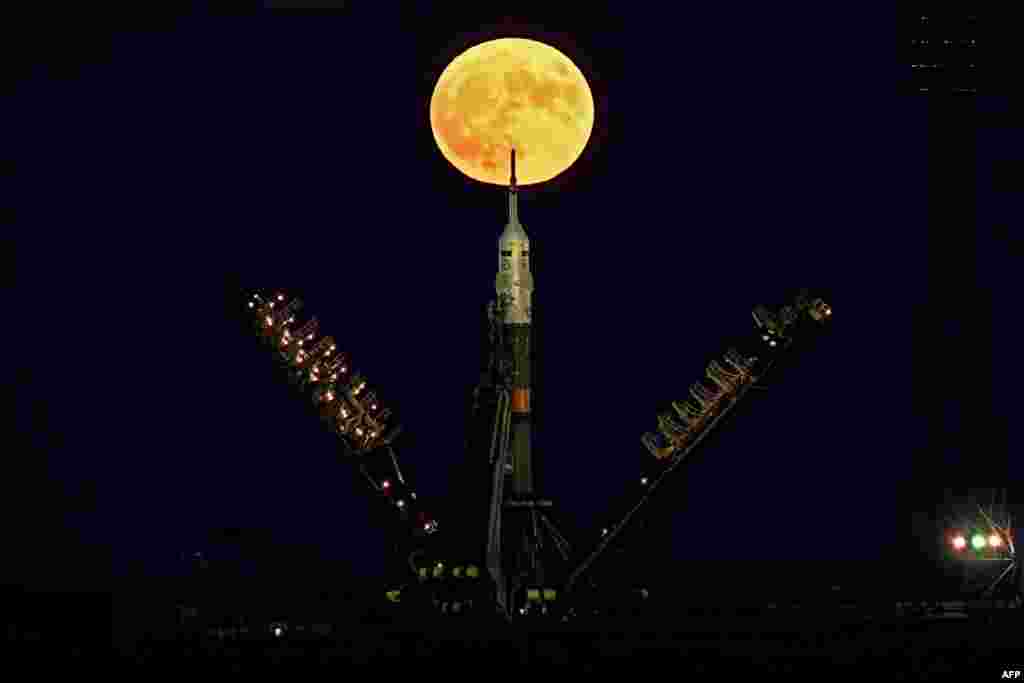 The supermoon is seen behind the Soyuz MS-03 spacecraft set on the launch pad at the Russian-leased Baikonur cosmodrome in Kazakhstan.