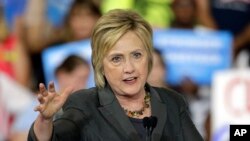 Democratic presidential candidate Hillary Clinton gestures as she speaks during a rally in Raleigh, North Carolina, June 22, 2016.