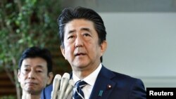 Japan's Prime Minister Shinzo Abe speaks to media at his official residence in Tokyo, Japan, Aug. 23, 2019. 