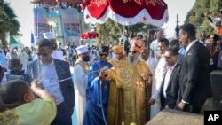 Patriarch of the Ethiopian Orthodox Church, Abune Mathias, sprays holy water on Christians as they celebrate the annual festival of Timkat, or Epiphany, marking the baptism of Jesus Christ in the River Jordan, in the capital Addis Ababa, Jan. 20.