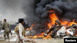 Hiện trường một trong những vụ tấn công bằng xe bom tự sát do Nhà nước Hồi giáo gây ra ở Iraq hồi tháng 3/2015.
