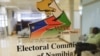 A worker sits inside the premises of the Electoral Commission of Namibia (ECN), following the country’s general election, in Windhoek on November 28, 2024.