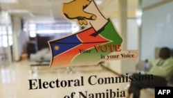 A worker sits inside the premises of the Electoral Commission of Namibia (ECN), following the country’s general election, in Windhoek on November 28, 2024.