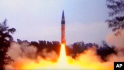 FILE - In this image made from Indian Ministry of Defense video, India's the Agni-V missile is launched from Wheeler Island off India's east coast, April 19, 2012.