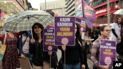 FILE - Turkish women shout slogans during a protest against President Recep Tayyip in Ankara, Turkey, June 6, 2016. 