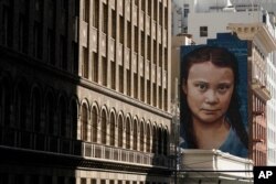FILE - A mural on the side of a building depicting Swedish climate activist Greta Thunberg is shown in San Francisco, March 4, 2021.