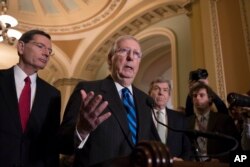 FILE - Senate Majority Leader Mitch McConnell, R-Ky., meets with reporters at the Capitol in Washington, Feb. 6, 2018.