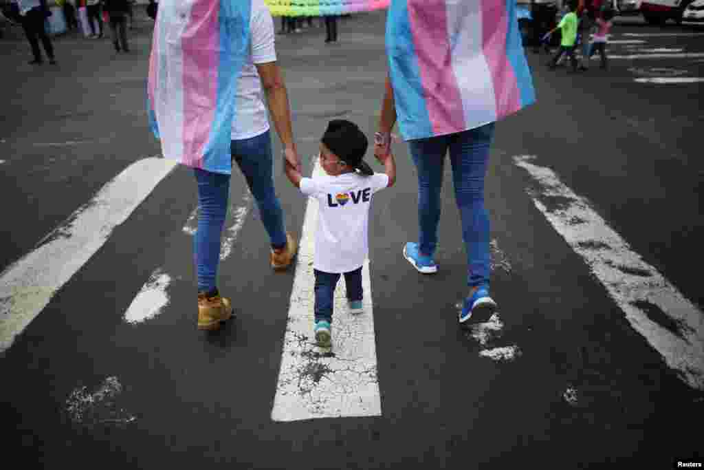People attend the Gay Pride Parade in San Salvador, El Salvador, June 24, 2017.