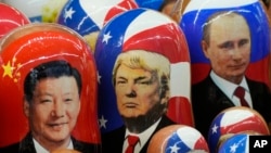 FILE - Traditional Russian wooden dolls depicting China's President Xi Jinping, U.S. President-elect Donald Trump and Russian President Vladimir Putin are displayed for sale at a souvenir shop in St. Petersburg, Russia, Nov. 21, 2024. 