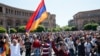 Armenian opposition supporters walk on the street after protest movement leader Nikol Pashinyan announced a nationwide campaign of civil disobedience in Yerevan, May 2, 2018. 