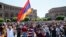 Armenian opposition supporters walk on the street after protest movement leader Nikol Pashinyan announced a nationwide campaign of civil disobedience in Yerevan, May 2, 2018. 