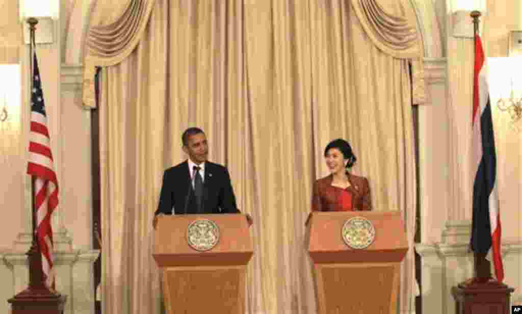 U.S. President Barack Obama, left, speaks as Thai Prime Minister Yingluck Shinawatra listens during a joint press conference at the Government House in Bangkok, Thailand, Sunday, Nov. 18, 2012. (AP Photo/Sakchai Lalit)