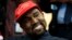 Rapper Kanye West smiles as he listens to a question from a reporter during a meeting in the Oval Office of the White House with President Donald Trump, Oct. 11, 2018, in Washington. 