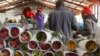 FILE - Workers pack roses for Valentine’s Day, at the AAA Growers’ farm in Nyahururu, four hours’ drive north of the capital Nairobi, in Kenya, Feb. 1, 2016.