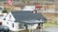 FILE - Ouellete's Gaz Bar, background, sits in Estcourt Station, Maine, 150 feet from the U.S. border with Canada at the town of Pohenegamook, Quebec.