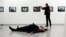 Russian Ambassador to Turkey Andrei Karlov lies on the ground after he was shot by Mevlut Mert Altintas at an art gallery in Ankara, Turkey, Dec. 19, 2016.