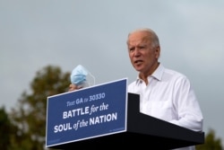 FILE - Democratic Presidential Candidate Joe Biden speaks during a voter mobilization event in Atlanta, on Oct. 27, 2020.