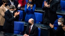 Olaf Scholz of the Social Democrats receives applause from lawmakers after he was elected new German Chancellor in the German Parliament Bundestag in Berlin, Wednesday, Dec. 8, 2021. (Photo/Stefanie Loos)