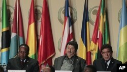 Libyan Foreign Minister Abdelati Obeidi, center, during the opening session of the 17th African Union Summit, at the Sipopo Conference Center outside Malabo, Equatorial Guinea, June 30, 2011