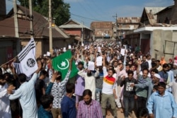 Kashmiri Muslims shout slogans during a protest after Eid prayers during a security lockdown in Srinagar, Indian-controlled Kashmir, Aug. 12, 2019.