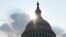 FILE - The dome of the U.S. Capitol Building is seen as the sun sets on Capitol Hill in Washington, July 26, 2019. 