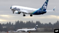 FILE - An Alaska Airlines plane takes off Jan. 26, 2016, at Seattle-Tacoma International Airport in Seattle. (AP Photo/Ted S. Warren)