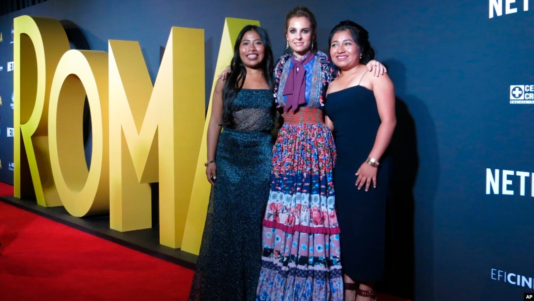 FILE - Mexican actresses who star in the Mexican film "Roma," Yalitza Aparicio, from left, Marina de Tavira and Nancy Garcia, pose on the red carpet in Mexico City, Nov. 21, 2018.