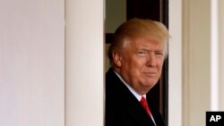 President Donald Trump awaits the arrival of Iraqi Prime Minister Haider al-Abadi at the White House in Washington, March 20, 2017. 