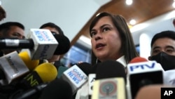 Philippine Vice President Sara Duterte talks to reporters at the House of Representatives in Quezon City, Philippines November 25, 2024. 