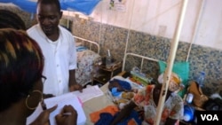 In Garoua, Cameroon, one of two nurses at the regional hospital explaining incidence of malnutrition (VOA/D.Ntaryike)