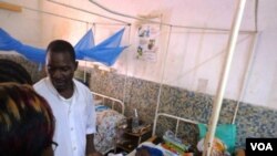 In Garoua, Cameroon, one of two nurses at the regional hospital explaining incidence of malnutrition (VOA/D.Ntaryike)