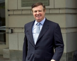 FILE - Paul Manafort, President Donald Trump's former campaign chairman, leaves the Federal District Court after a hearing in Washington, May 23, 2018.