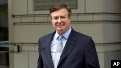 FILE - Paul Manafort, President Donald Trump's former campaign chairman, leaves U.S. District Court after a hearing in Washington, May 23, 2018.
