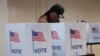 FILE PHOTO: Voters cast their votes during early voting in the U.S. presidential election at a polling station in Detroit, Michigan,