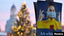 Плакат з написом «Я захищаю вас» у Дрездені, Німеччина. 14 грудня 2020 р.