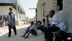 African migrant workers are seen at a farm where they had been hiding from rebel forces in Tripoli, Libya, August 28, 2011.