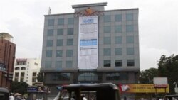 A banner announces the public stock sale of SKS Microfinance at the company's headquarters in Hyderabad in July