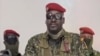 A screengrab taken from footage sent to AFP by a military source shows Guinean Colonel Mamady Doumbouya delivering a speech following the dissolution of the government during a coup d'etat in Conakry, September 5, 2021.