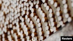 FILE - Cigarettes are seen during the manufacturing process in the British American Tobacco Cigarette Factory (BAT) in Bayreuth, southern Germany, April 30, 2014. 