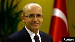 FILE - Turkish Deputy Prime Minister Mehmet Simsek is in Ankara, Dec. 23, 2015.