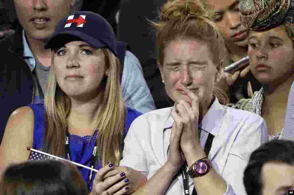 Supporters watch the election results during Democratic presidential nominee Hillary Clinton's election night rally in the Jacob Javits Center glass enclosed lobby in New York, Nov. 8, 2016. 