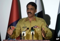 FILE - Pakistan's army spokesman Maj. Gen. Asif Ghafoor addresses a news conference in Rawalpindi, Pakistan, April 17, 2017.