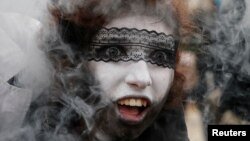 FILE - A participant takes part in a "Zombie Walk" parade in Kyiv, Ukraine, Oct. 28, 2017. 