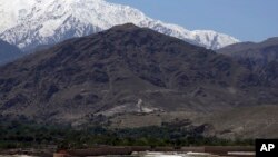 FILE - Smokes rises from the area during an operation near the area bombed by U.S. forces in the Achin district of Jalalabad, east of Kabul, Afghanistan, April 14, 2017. 