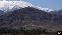 FILE - Smokes rises from the area during an operation near the area bombed by U.S. forces in the Achin district of Jalalabad, east of Kabul, Afghanistan, April 14, 2017. 